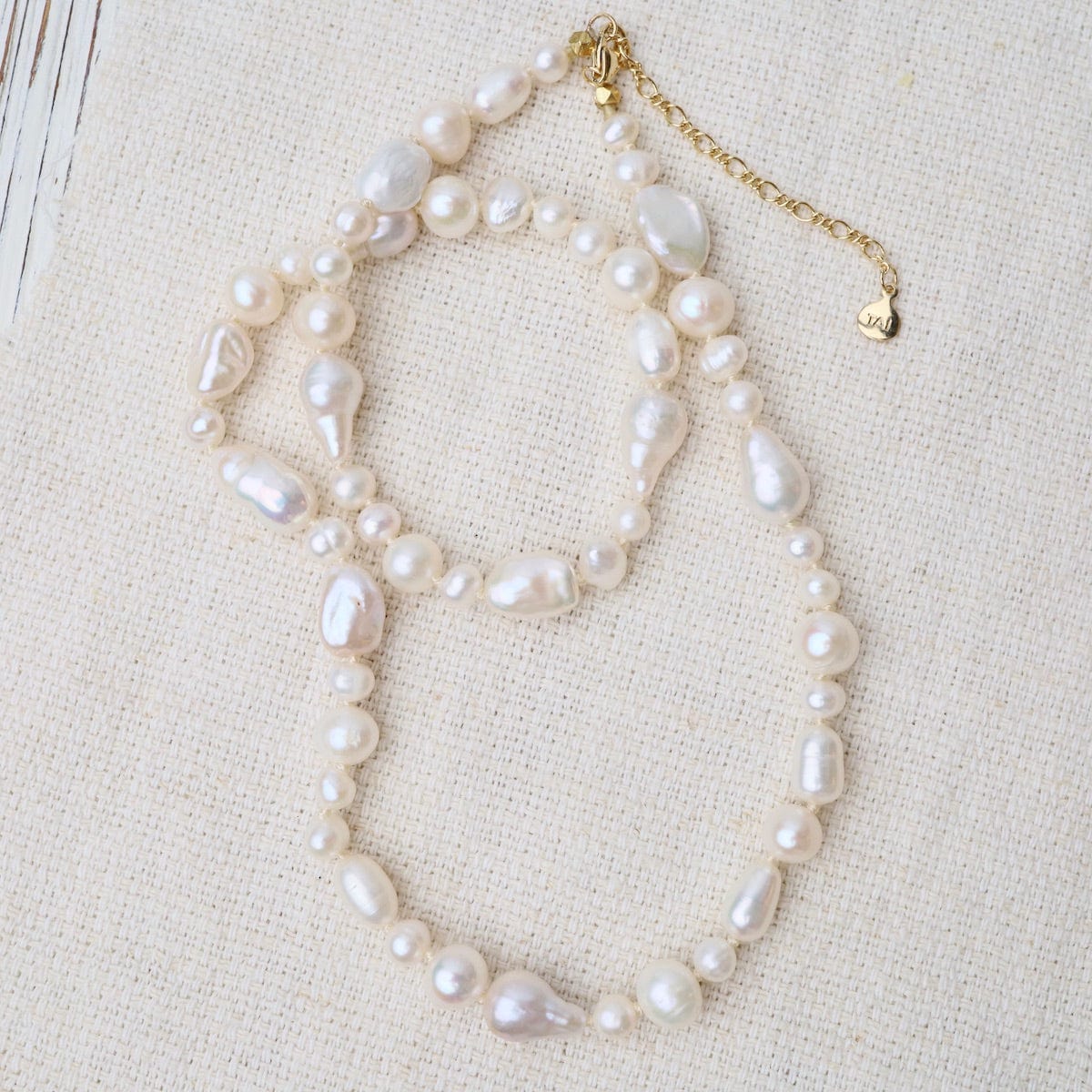 NKL-GPL Knotted Fresh Water Baroque Pearls with Beige Cord