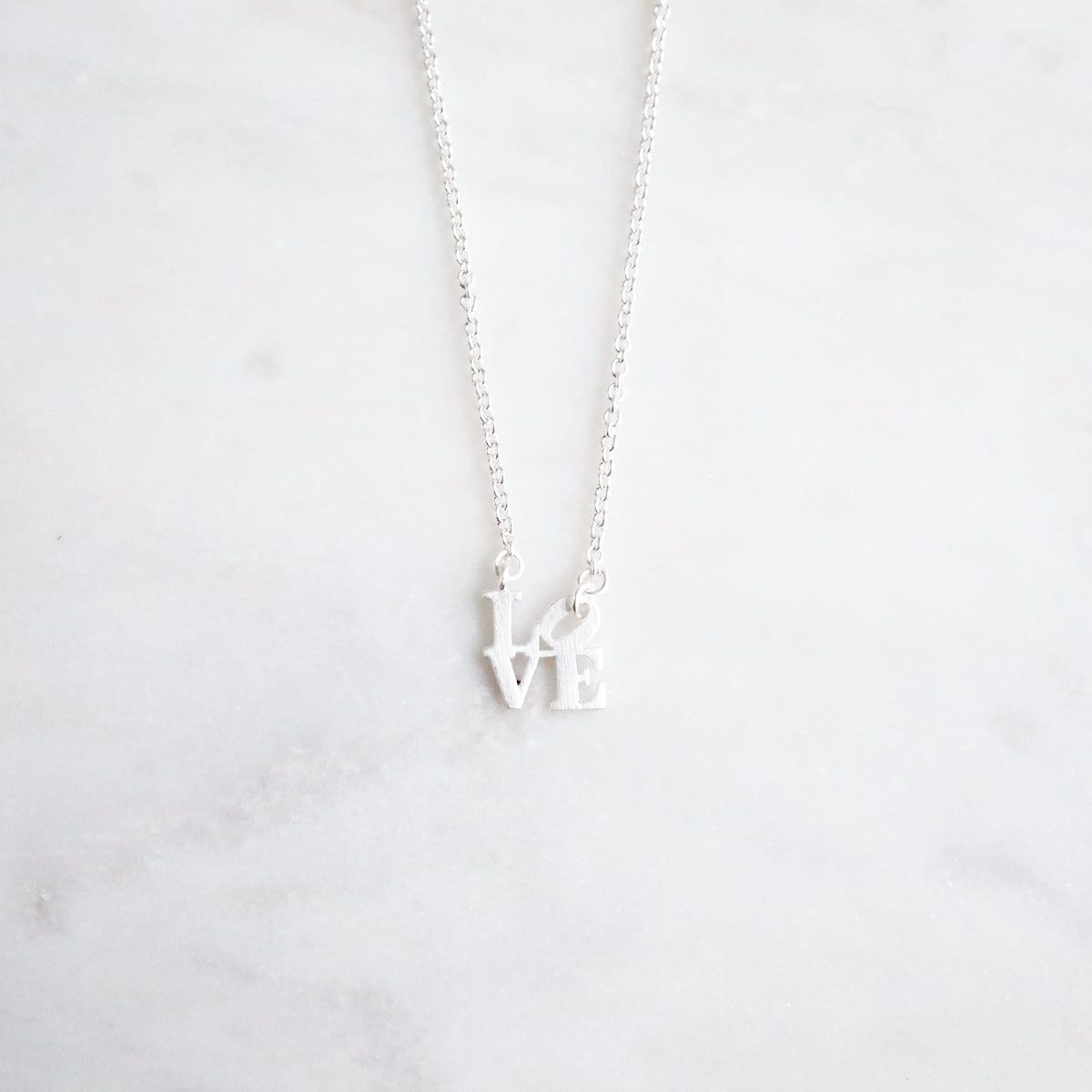 NKL Matte Silver Extra Petite LOVE Sculpture Necklace