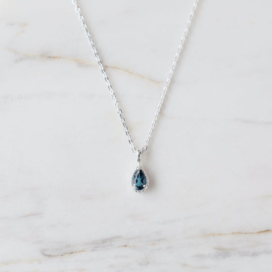 NKL Sterling Silver Pear Cut London Blue Topaz with Milgrain Edge Necklace