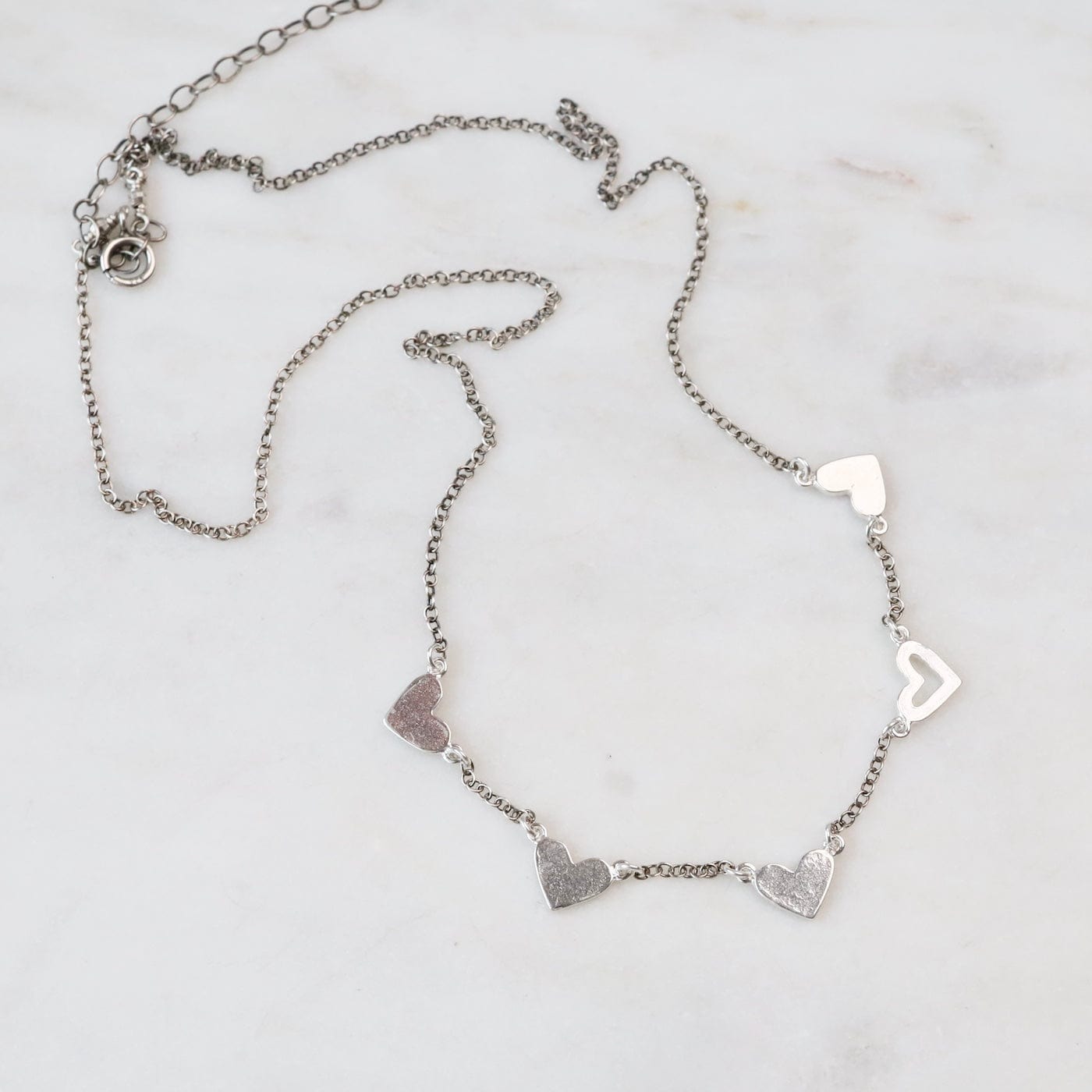 NKL String of Hearts Necklace in Sterling Silver