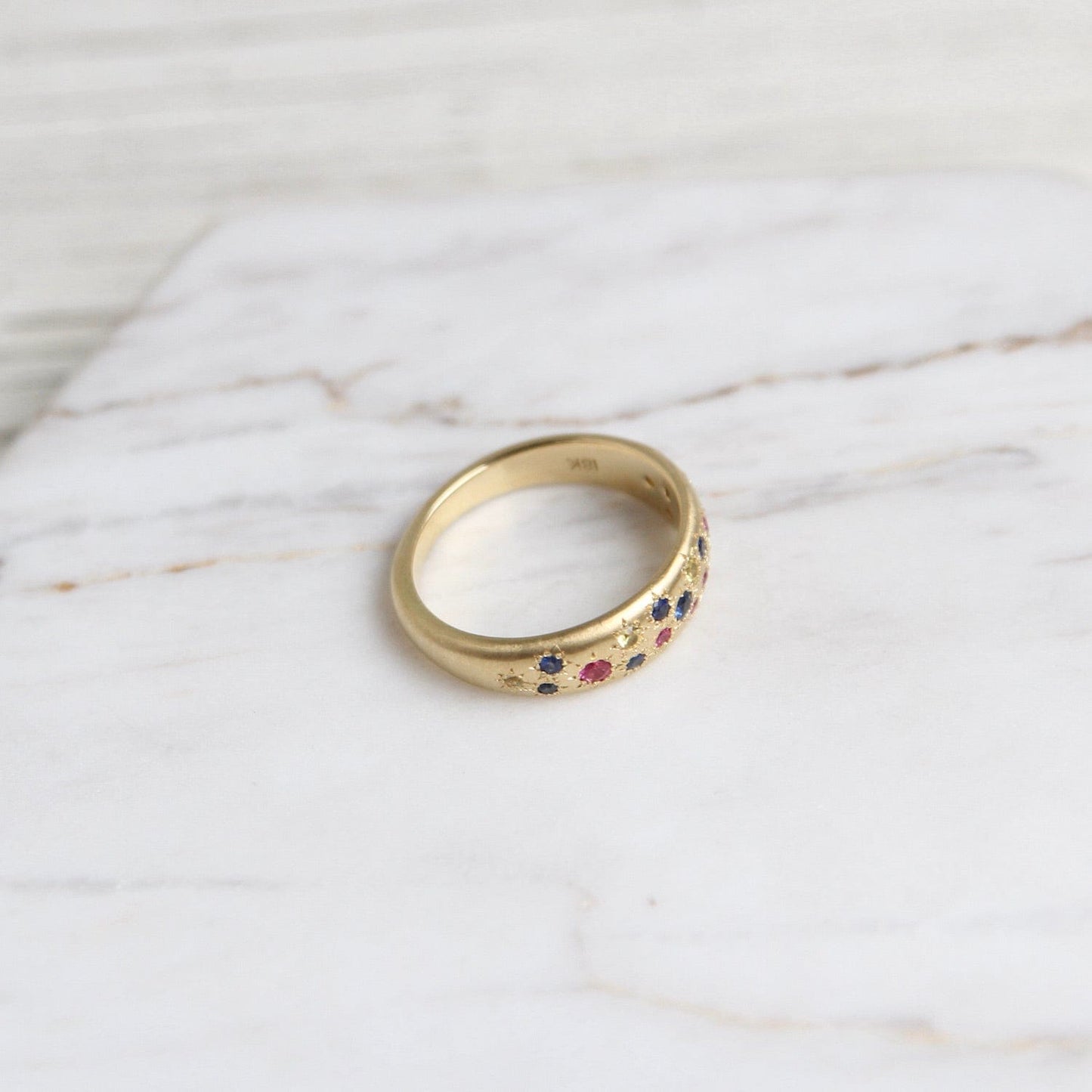 RING-18K Tapered Multi Sapphire Band