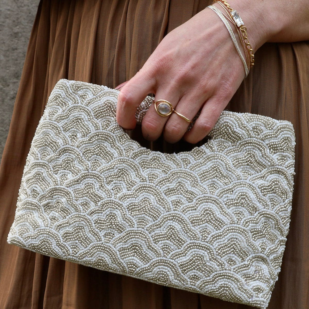 
                  
                    BAG Cut Out Handle Clutch in Ivory and Silver Waves
                  
                