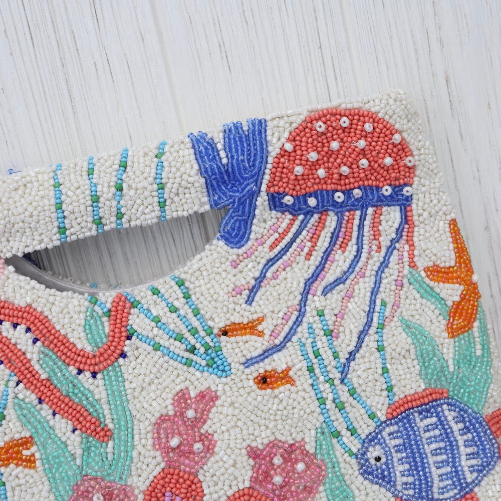 
                  
                    BAG Cut Out Handle Clutch in Under the Sea
                  
                