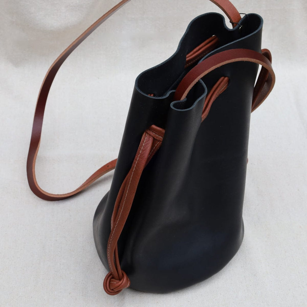 
                      
                        BAG The Ana Bucket in Black with Cognac
                      
                    