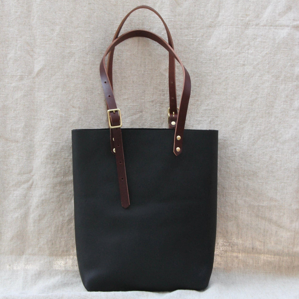 
                      
                        BAG The Leona Tote in Black & Cognac
                      
                    