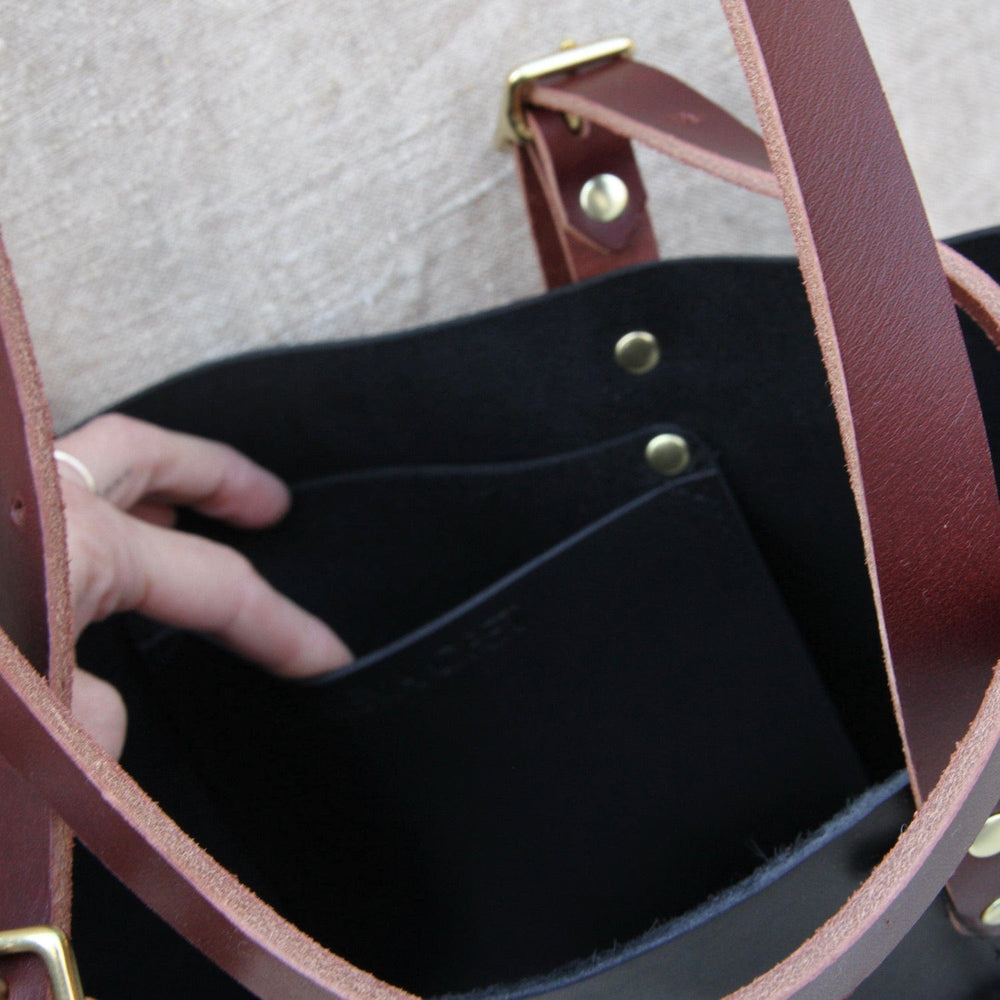 
                      
                        BAG The Leona Tote in Black & Cognac
                      
                    