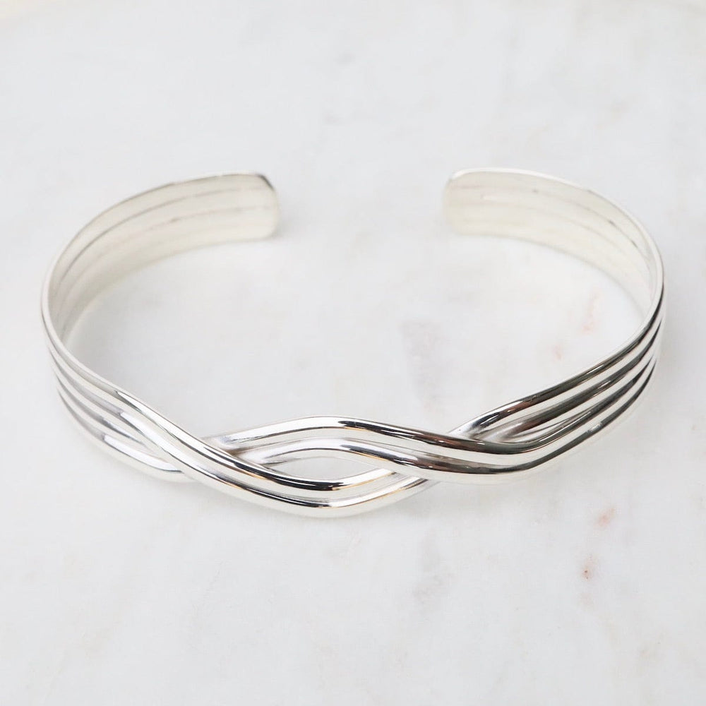 
                      
                        BRC 1/2" 4 Strand Overlapping Sterling Silver Cuff
                      
                    