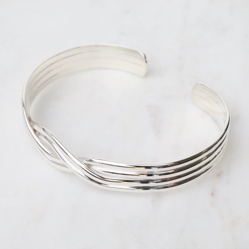 
                      
                        BRC 1/2" 4 Strand Overlapping Sterling Silver Cuff
                      
                    