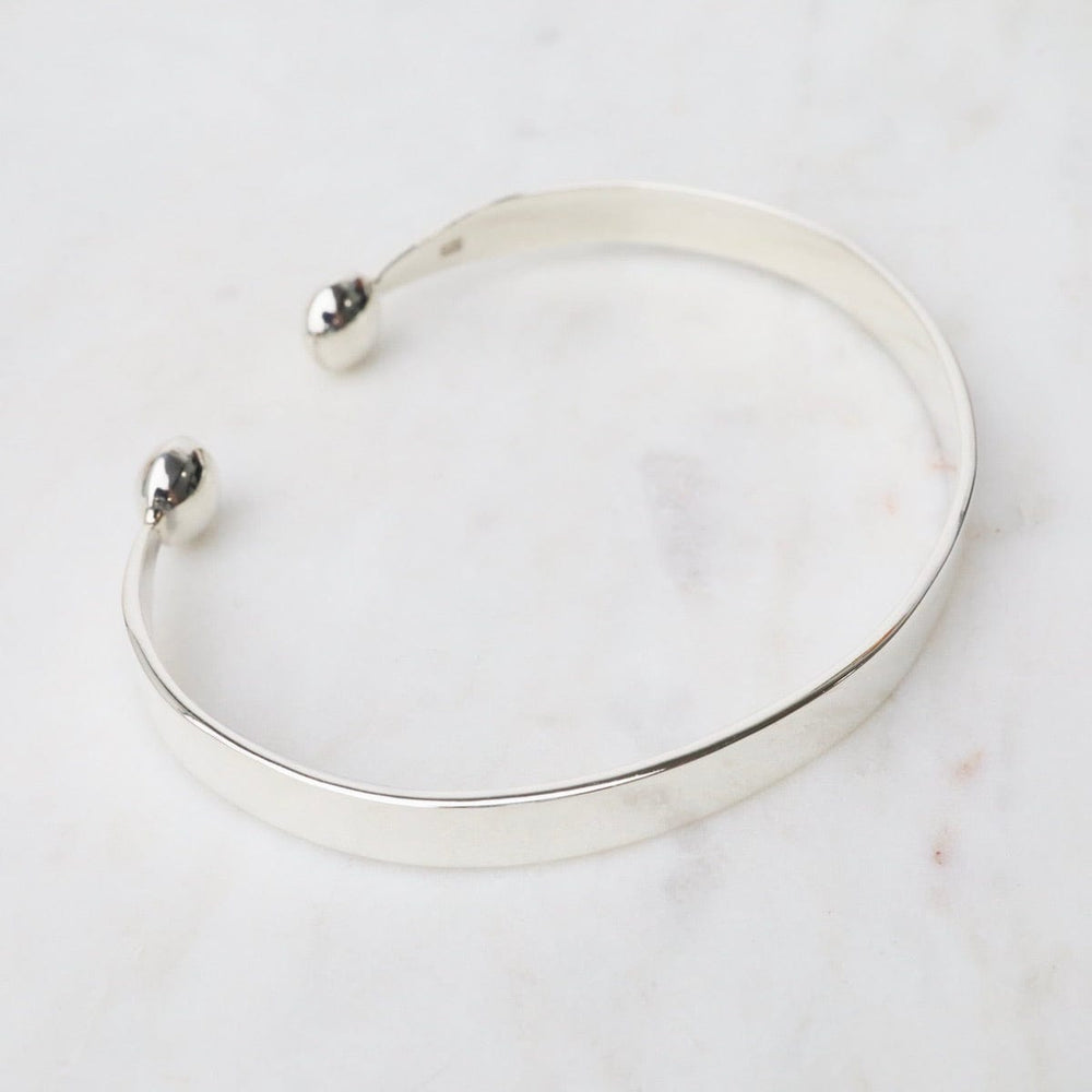 
                      
                        BRC 1/2" Simple Sterling Silver Cuff with Ball Ends
                      
                    