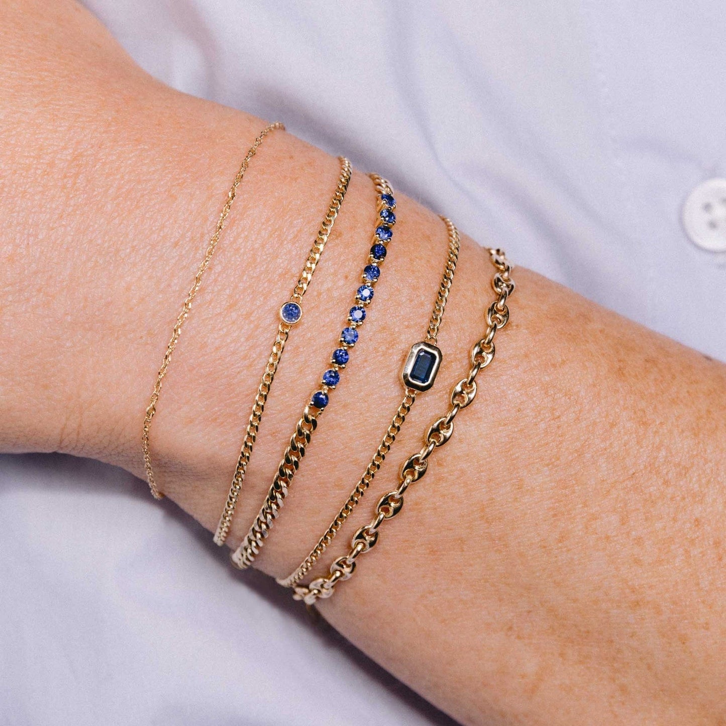 BRC-14K 14k Emerald Cut Blue Sapphire XS Curb Chain Bracelet
