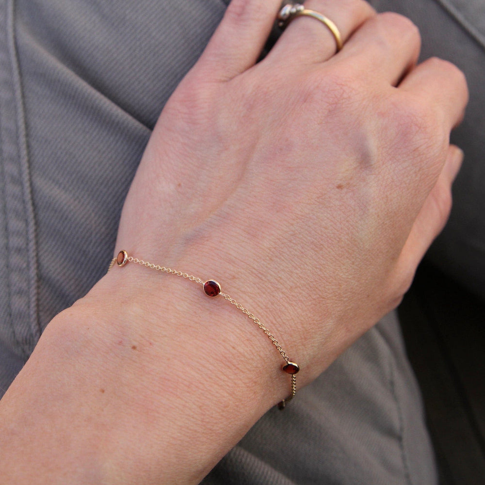 
                  
                    BRC-14K 14k Garnet Station Bracelet
                  
                