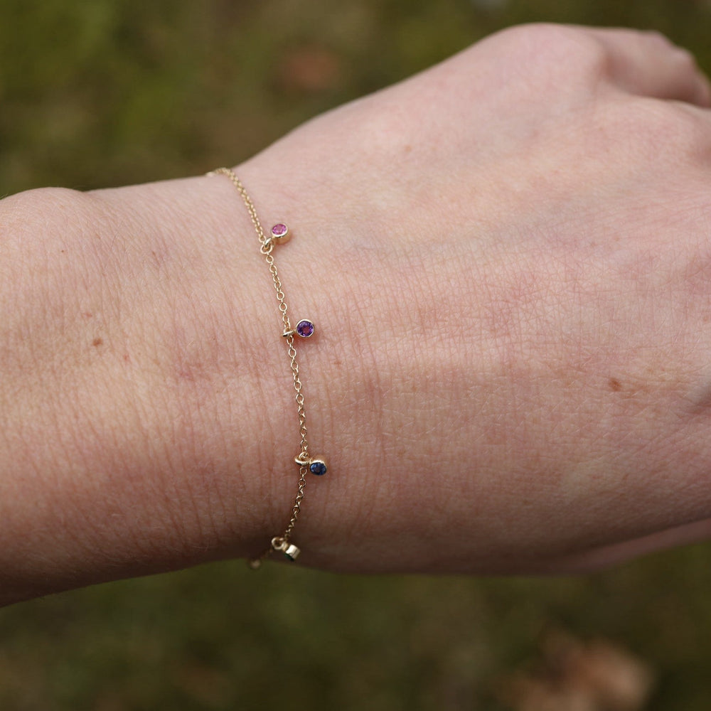 
                  
                    BRC-14K 14k Gold Bracelet with Dangling Rainbow Sapphires
                  
                