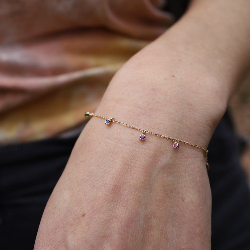 
                  
                    BRC-14K 14k Gold Bracelet with Dangling Rainbow Sapphires
                  
                