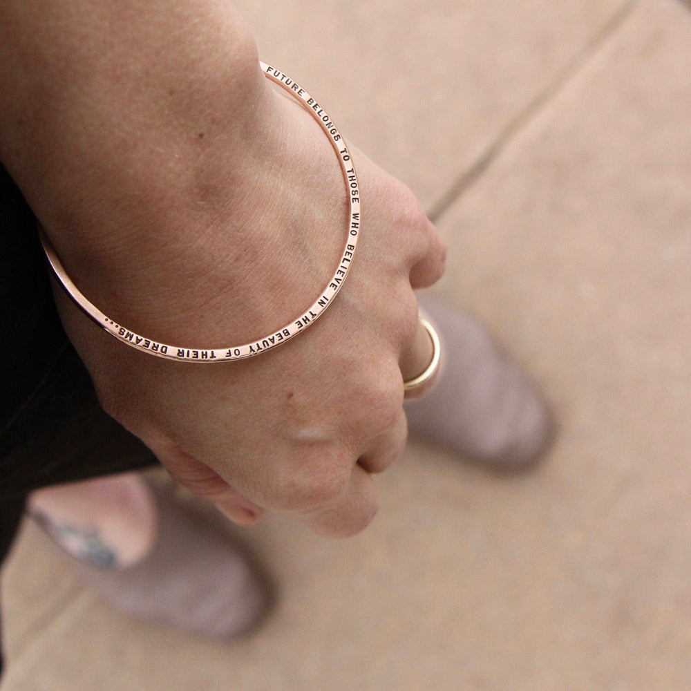 
                  
                    BRC-14K 14k Rose Gold Flat Hand Stamped Bangle ~ "The future belongs to those who believe..."
                  
                