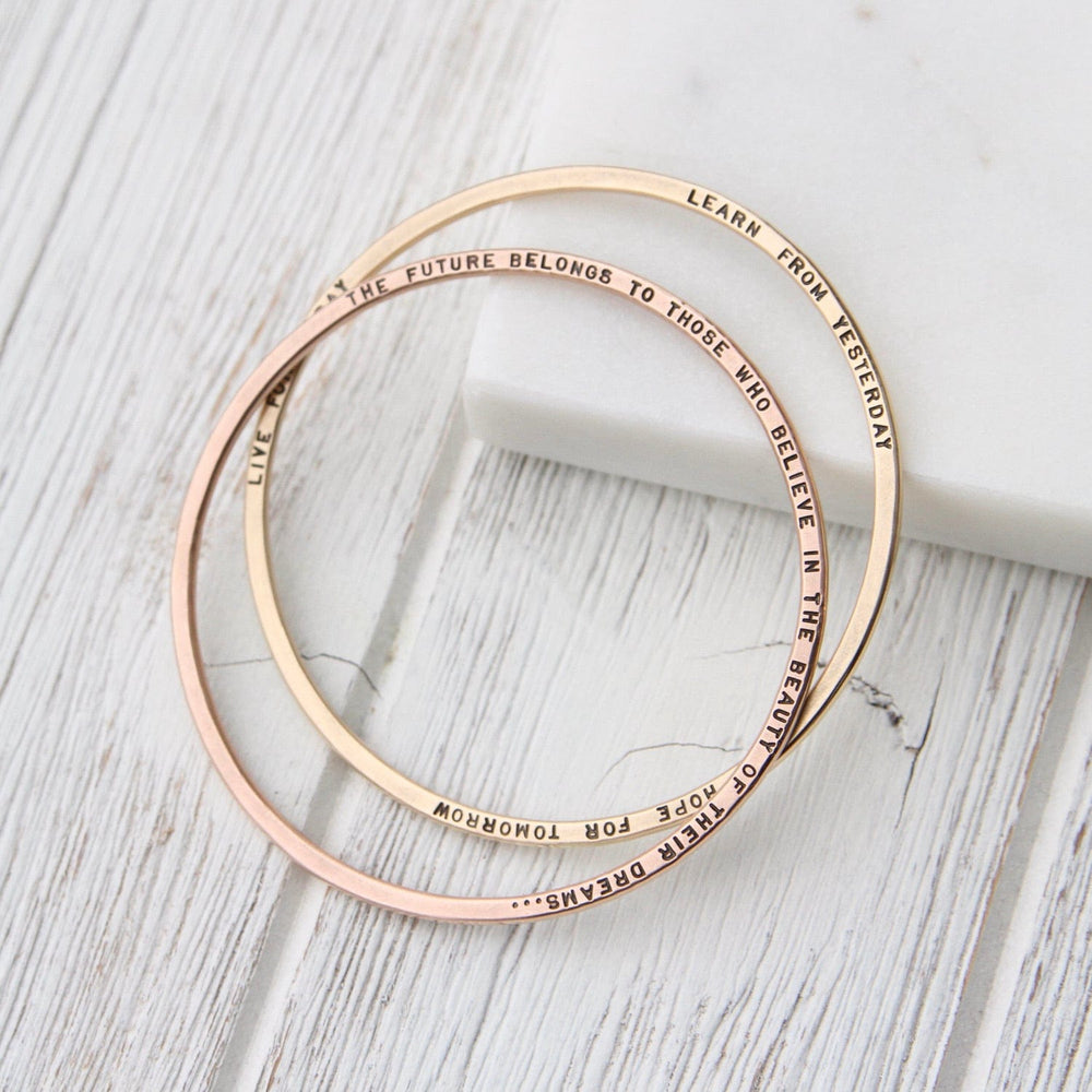 
                  
                    BRC-14K 14k Rose Gold Flat Hand Stamped Bangle ~ "The future belongs to those who believe..."
                  
                