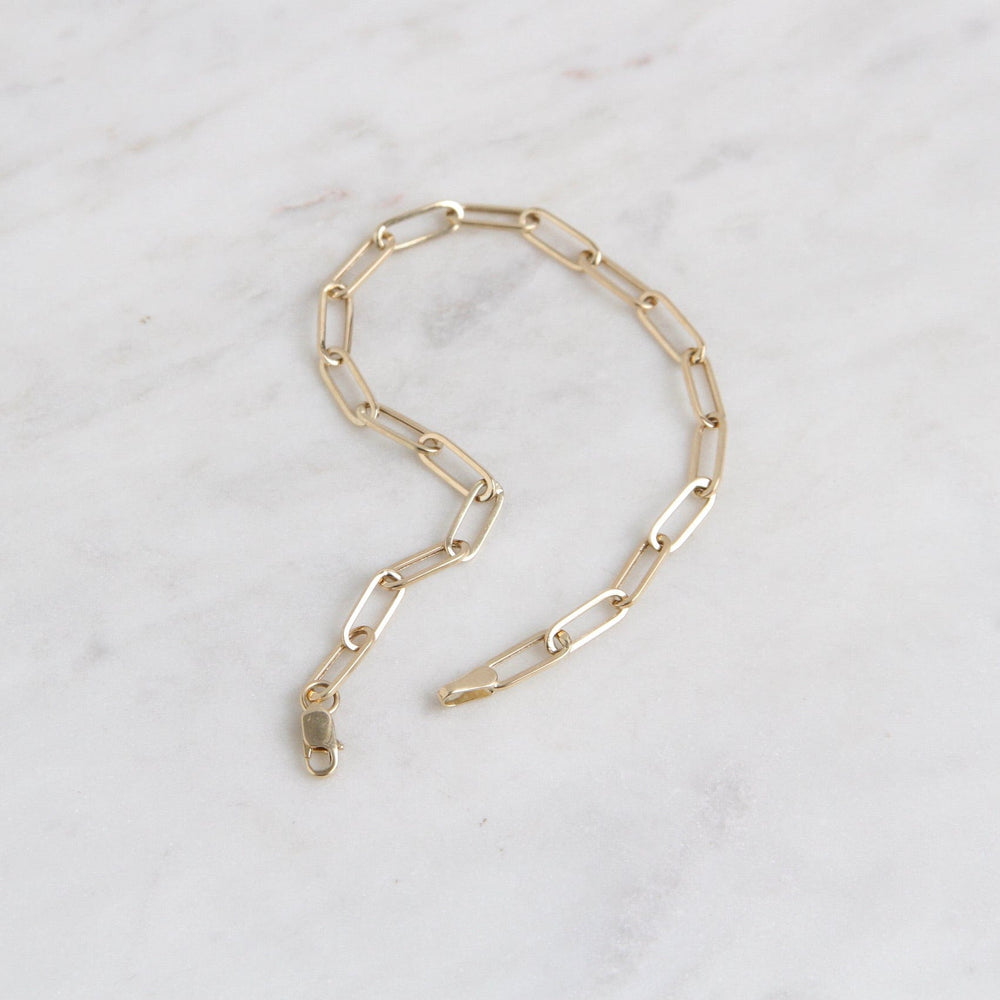 
                      
                        BRC-14K 14k Yellow Gold Mini Paperclip Chain Bracelet
                      
                    