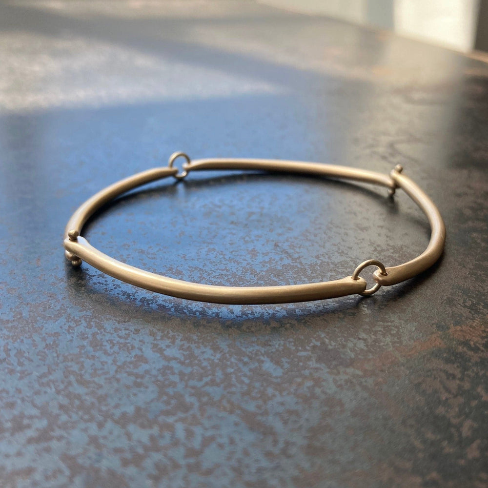 
                  
                    BRC-14K Rivet and Ring Bangle
                  
                