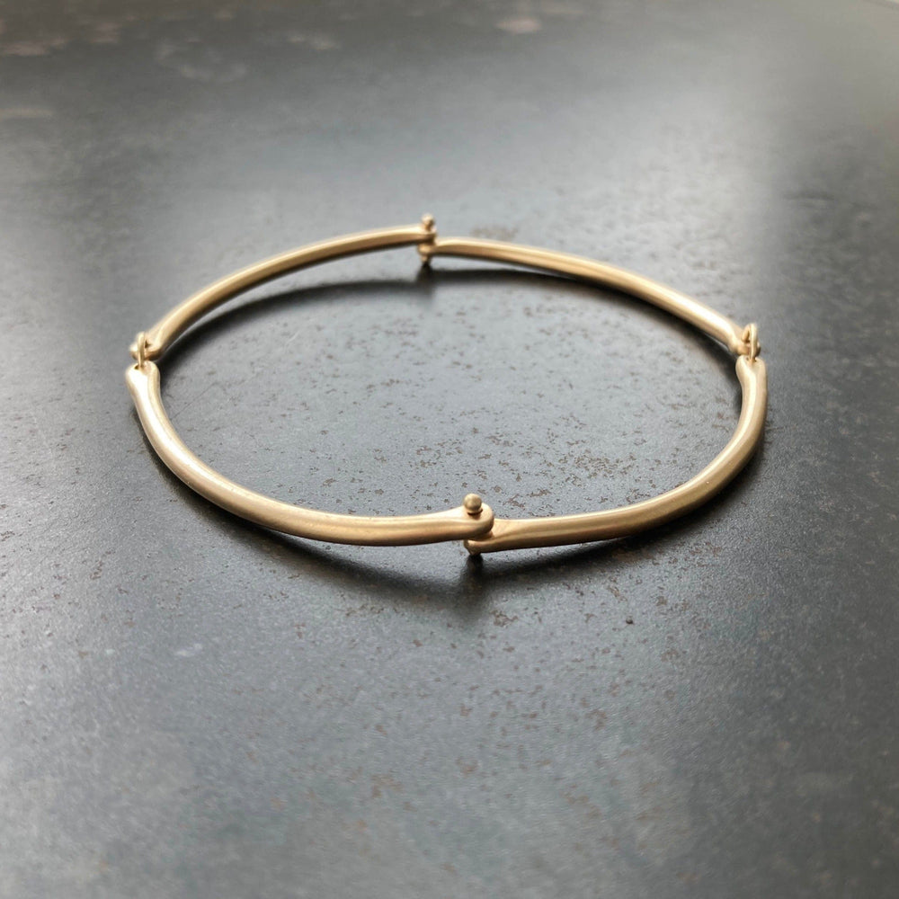 
                  
                    BRC-14K Rivet and Ring Bangle
                  
                