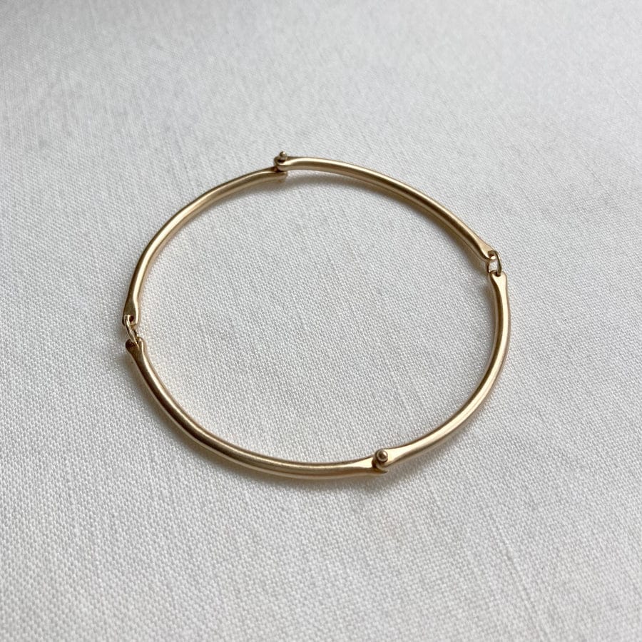 
                  
                    BRC-14K Rivet and Ring Bangle
                  
                