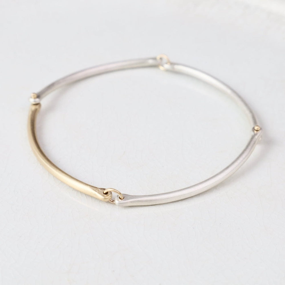 
                  
                    BRC-14K Rivet and Ring Bangle
                  
                