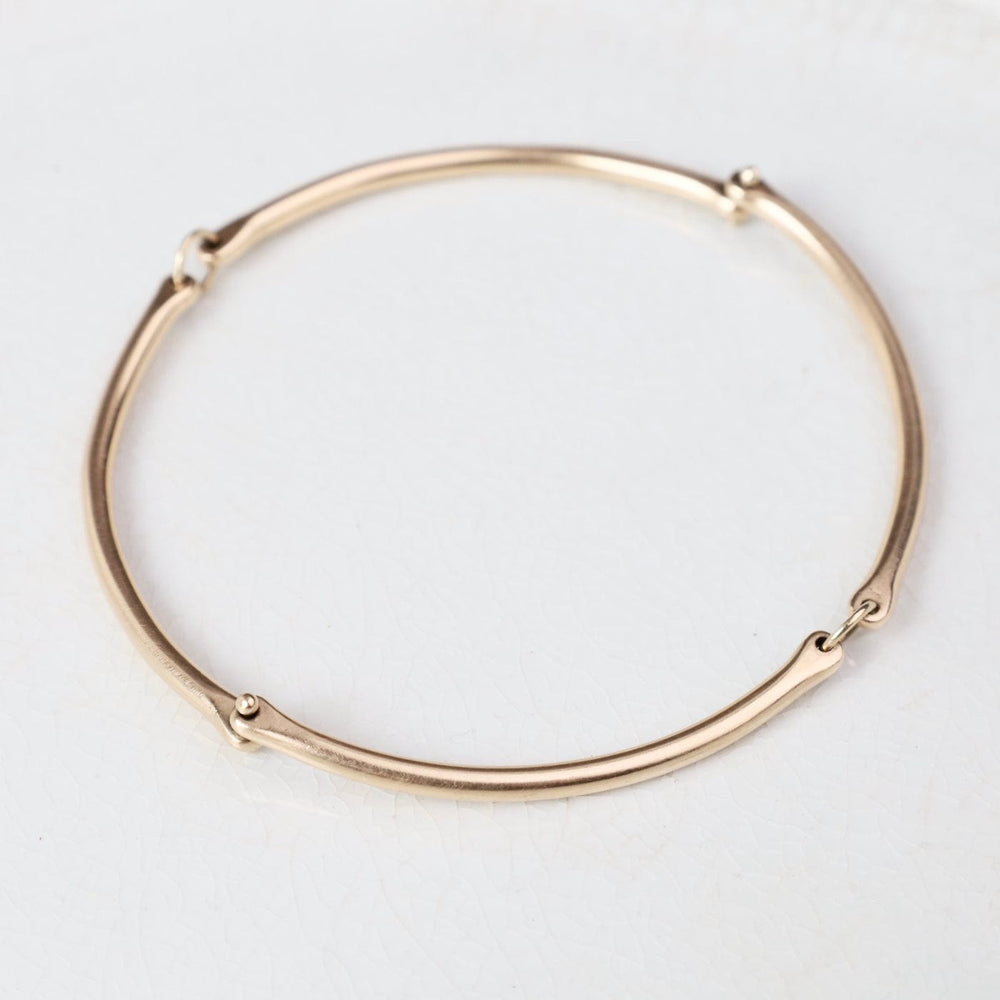 
                  
                    BRC-14K Rivet and Ring Bangle
                  
                