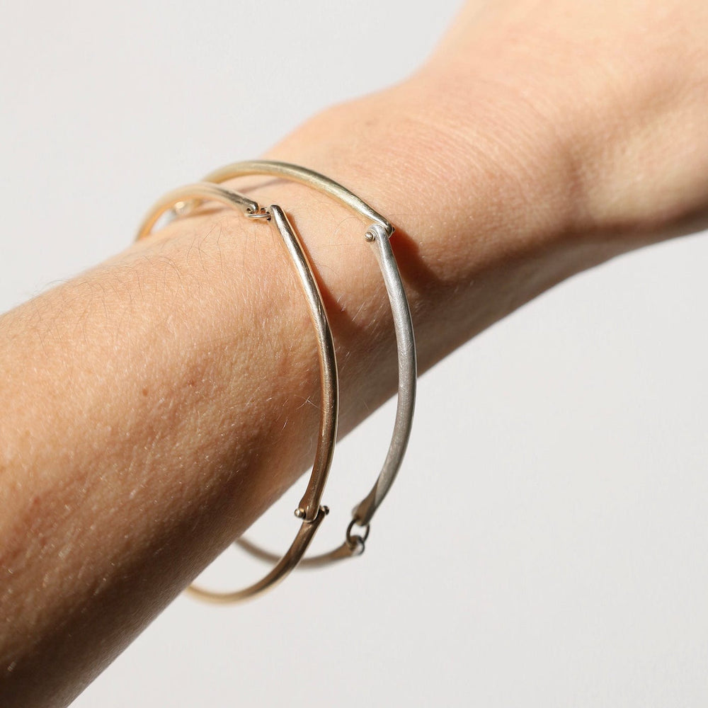 
                  
                    BRC-14K Rivet and Ring Bangle
                  
                