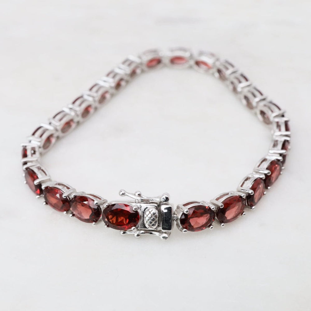 
                  
                    BRC 7.5" 5x7mm Oval Garnet Tennis Bracelet
                  
                