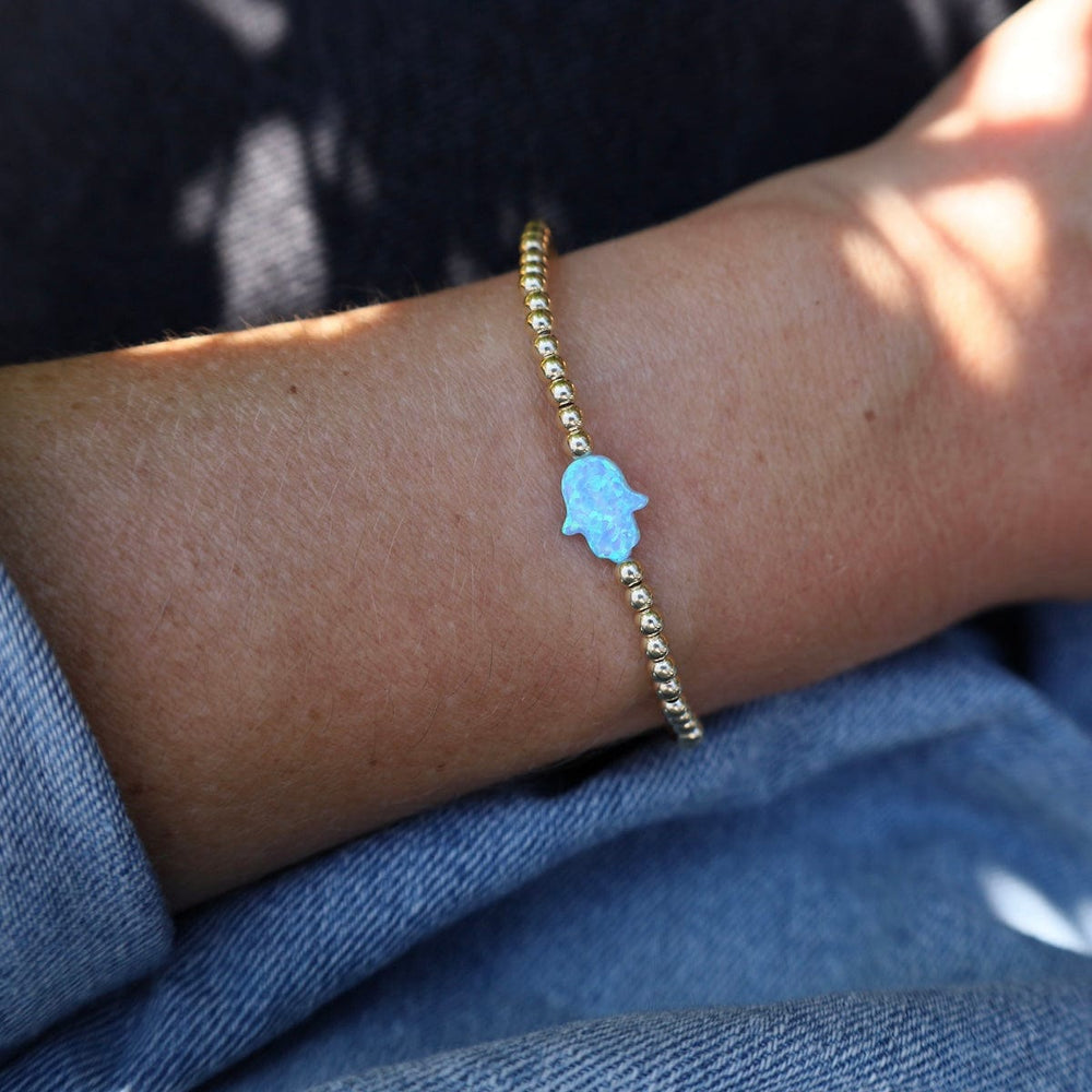 
                      
                        BRC Blue Opal Hamsa Gold Filled Ball Bracelet
                      
                    