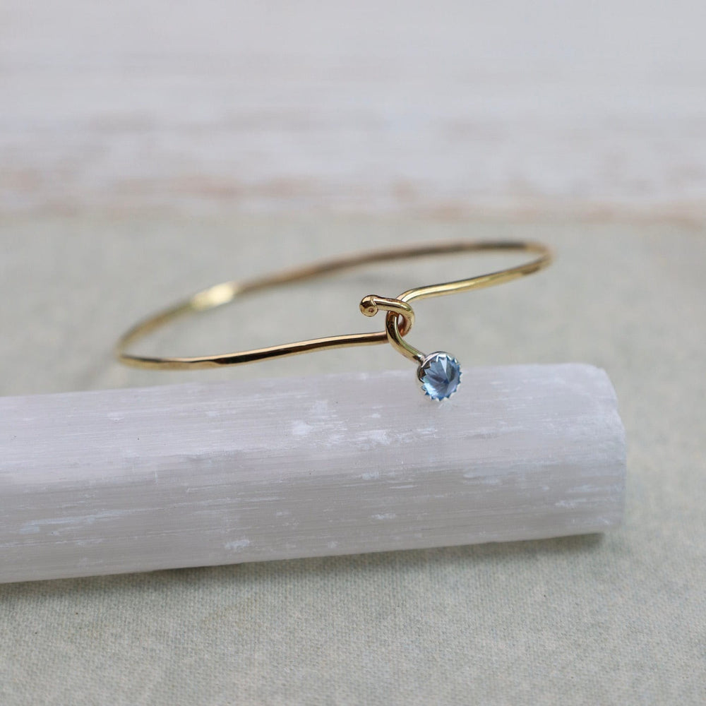 
                  
                    BRC Blue Topaz Dew Drop Brass Bracelet
                  
                