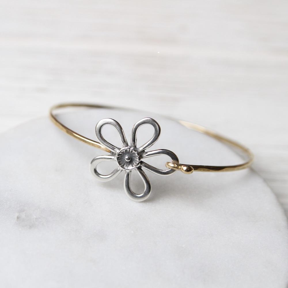 
                      
                        BRC-BRASS Brass Bracelet With Silver Flower
                      
                    