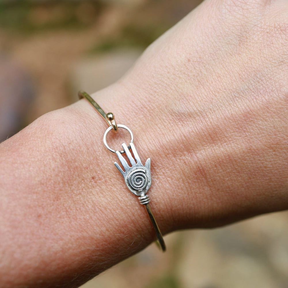 
                  
                    BRC-BRASS Brass Bracelet with Silver Hamsa
                  
                