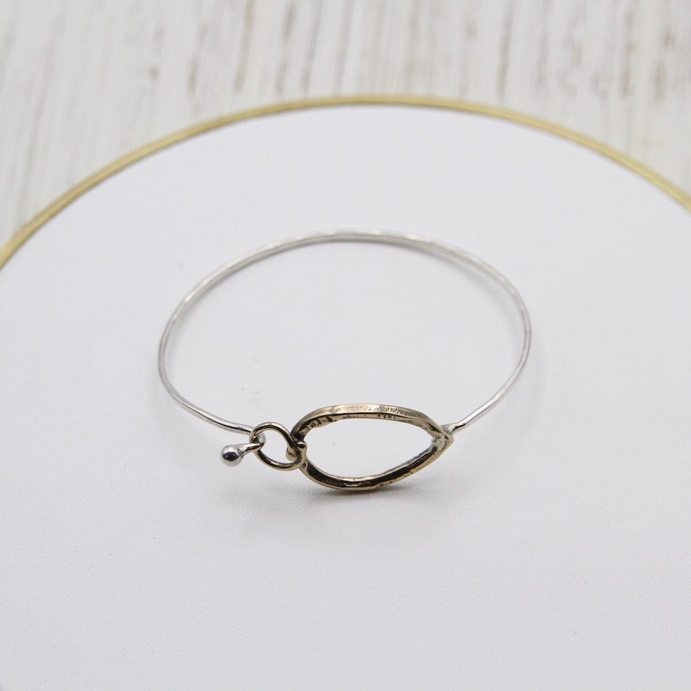 
                  
                    BRC Brass Pear and Circle Clasp on Sterling Silver Bangle
                  
                