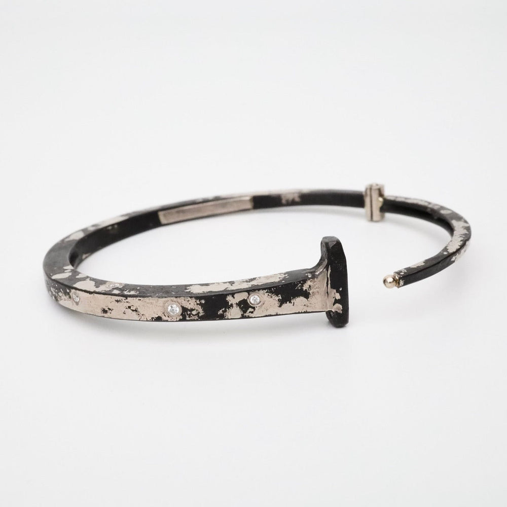 
                  
                    BRC-DIA Pat Flynn White Gold Dusted Scattered 9 Diamond Nail Bracelet
                  
                