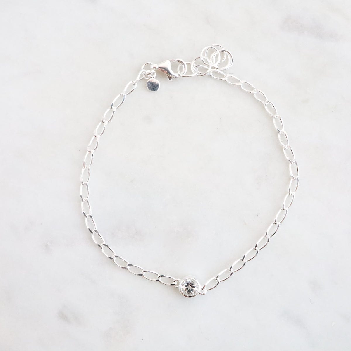 BRC Fine Cut Curb Chain with Round Bezel Set White Topaz Bracelet