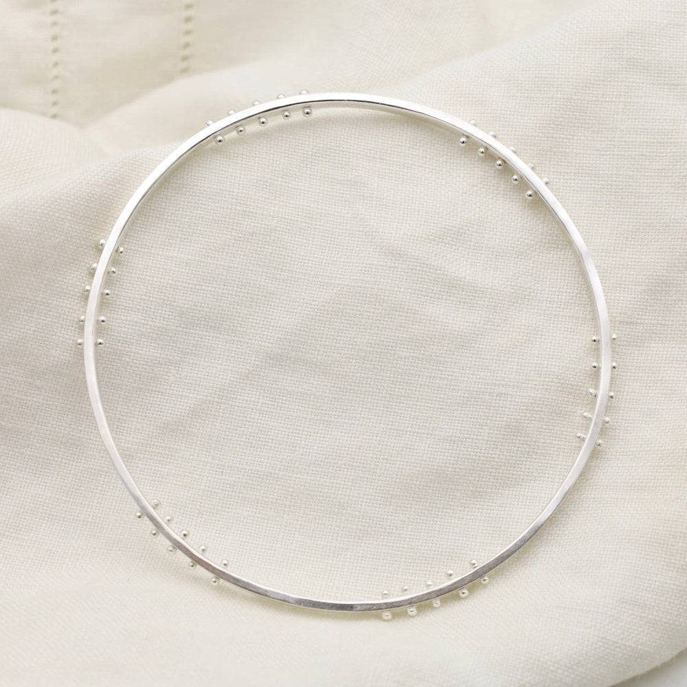 
                  
                    BRC Five Kinetic Dot Bangle in Polished Silver
                  
                