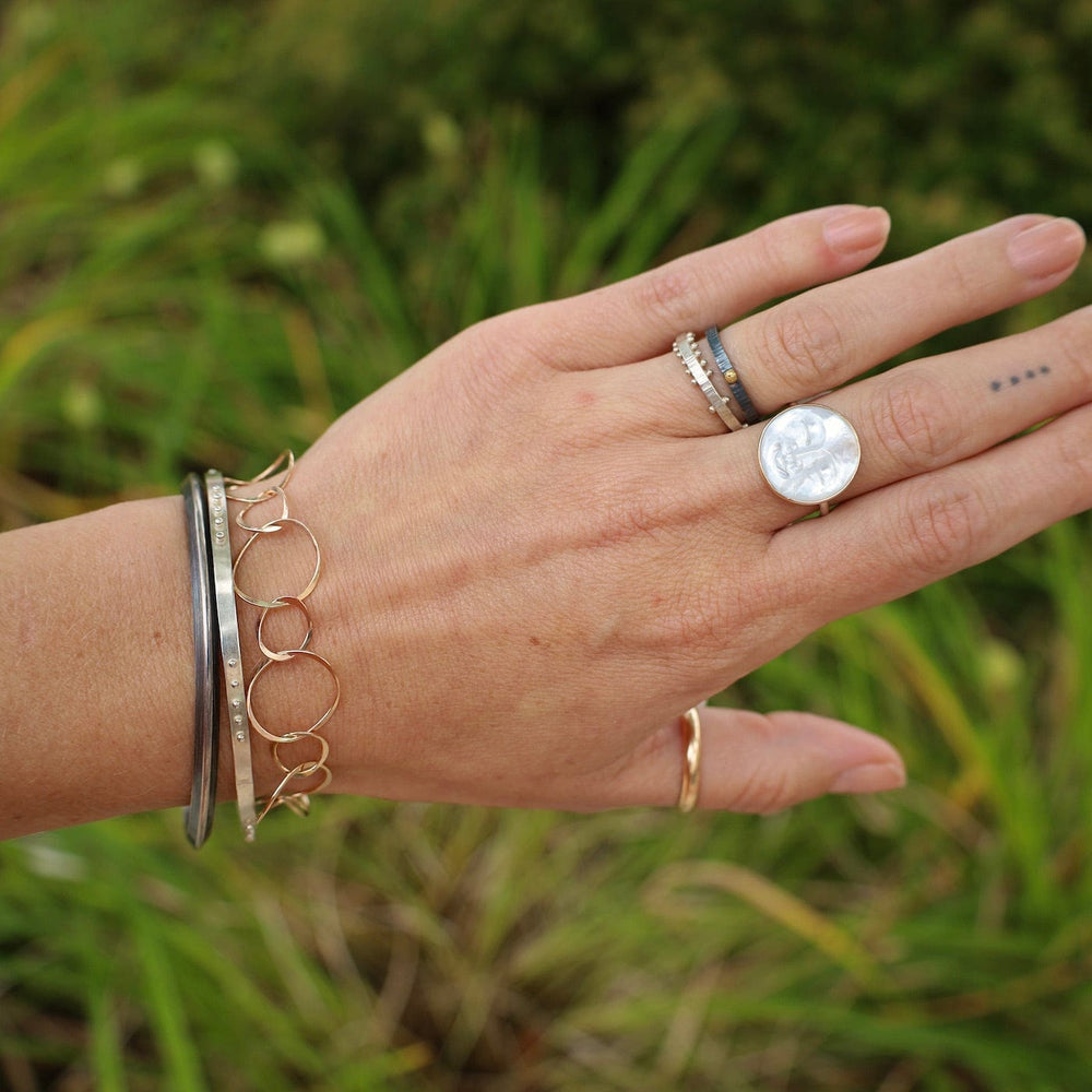 
                  
                    BRC Five Kinetic Dot Bangle in Polished Silver
                  
                