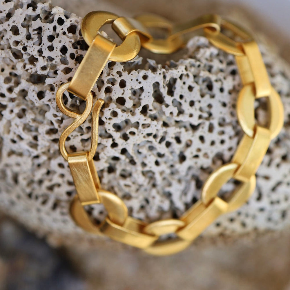 
                      
                        BRC-GPL Cut Out Disc Chain Bracelet - Gold Plated Brass
                      
                    