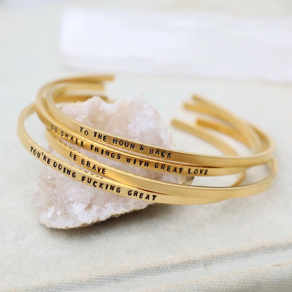 
                  
                    BRC-GPL Do Small Things with Great Love Stamped Gold Plated Cuff Bracelet
                  
                