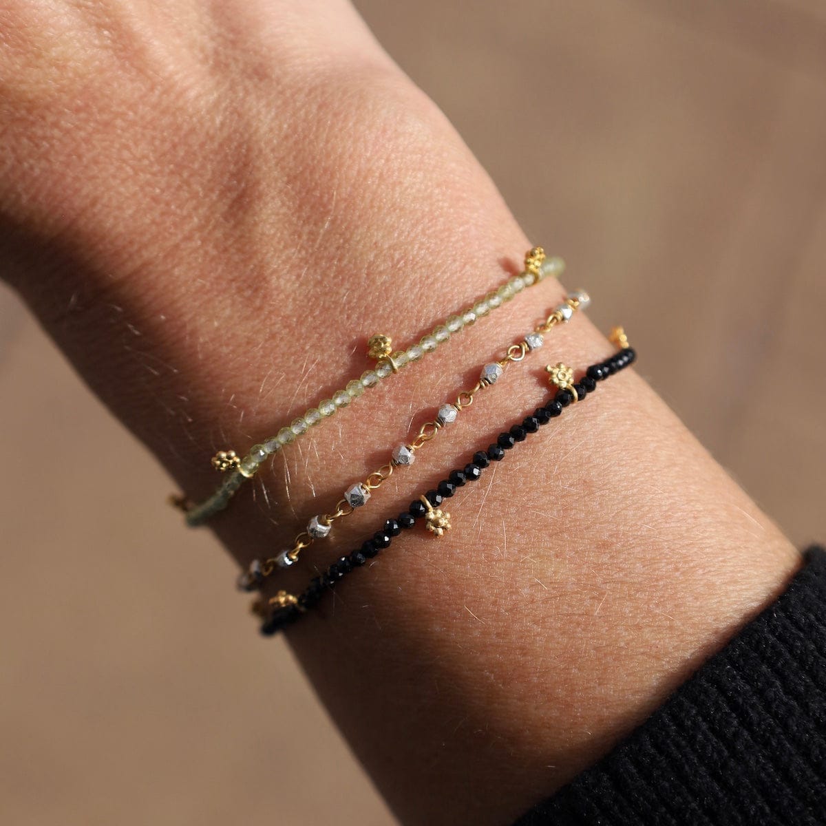 BRC-GPL Faceted Black Onyx with Gold Charms Bracelet