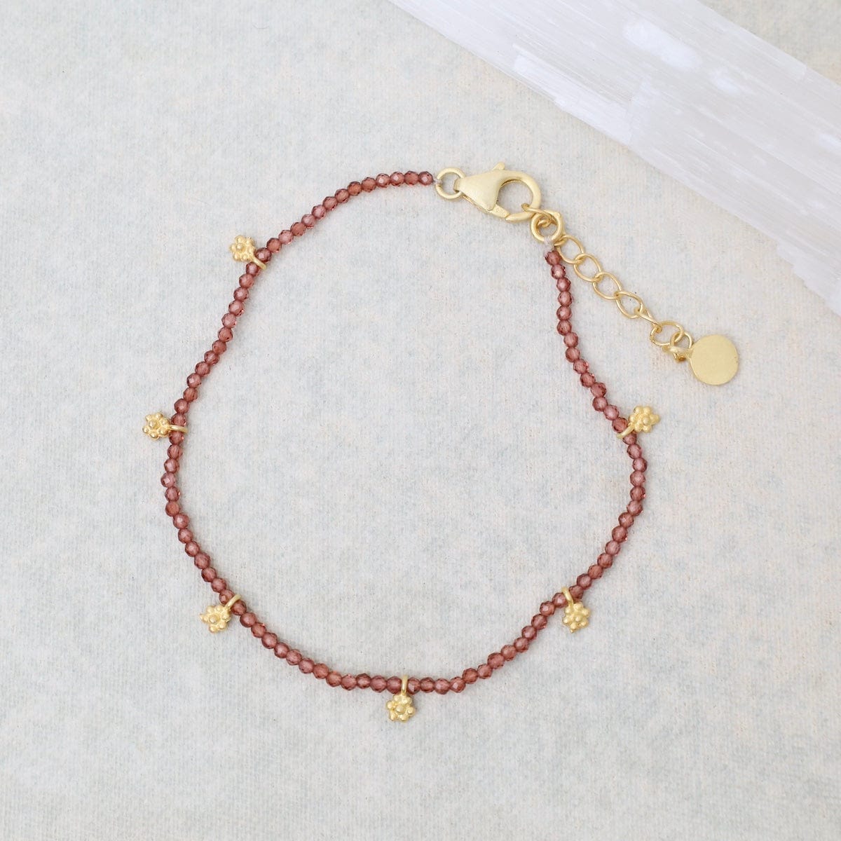 BRC-GPL Faceted Garnets with Gold Charms Bracelet