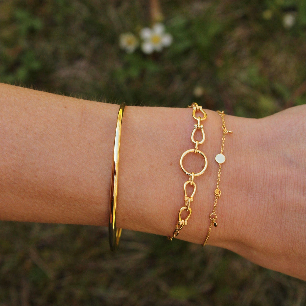 
                      
                        BRC-GPL Gold Geometry Drop Discs Bracelet
                      
                    