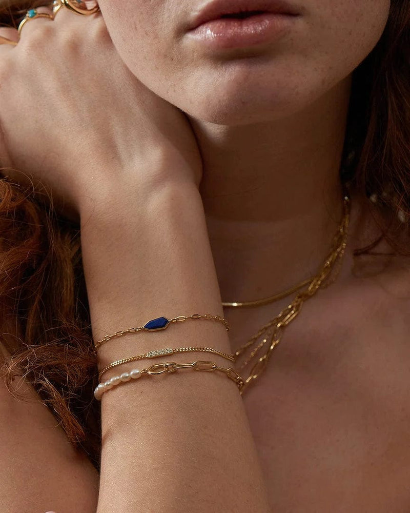 
                  
                    BRC-GPL Gold Lapis Emblem Chain Bracelet
                  
                