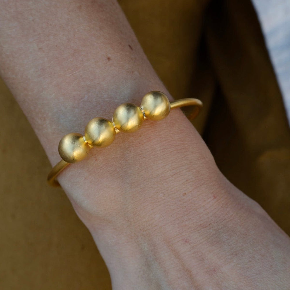 
                      
                        BRC-GPL Gold Plated Brass Four Ball Cuff Bracelet
                      
                    