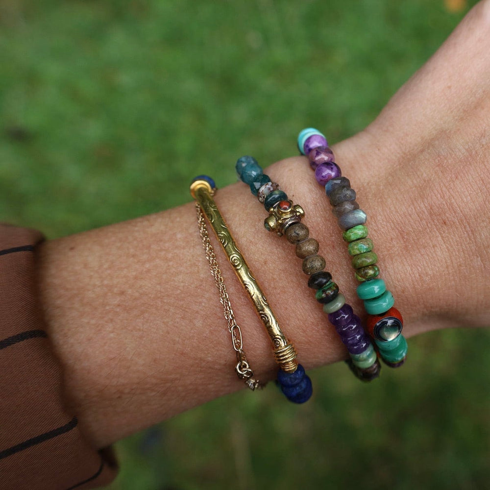 
                      
                        BRC-GPL Lapis Tear Jerker with Gold Bar Bracelet
                      
                    