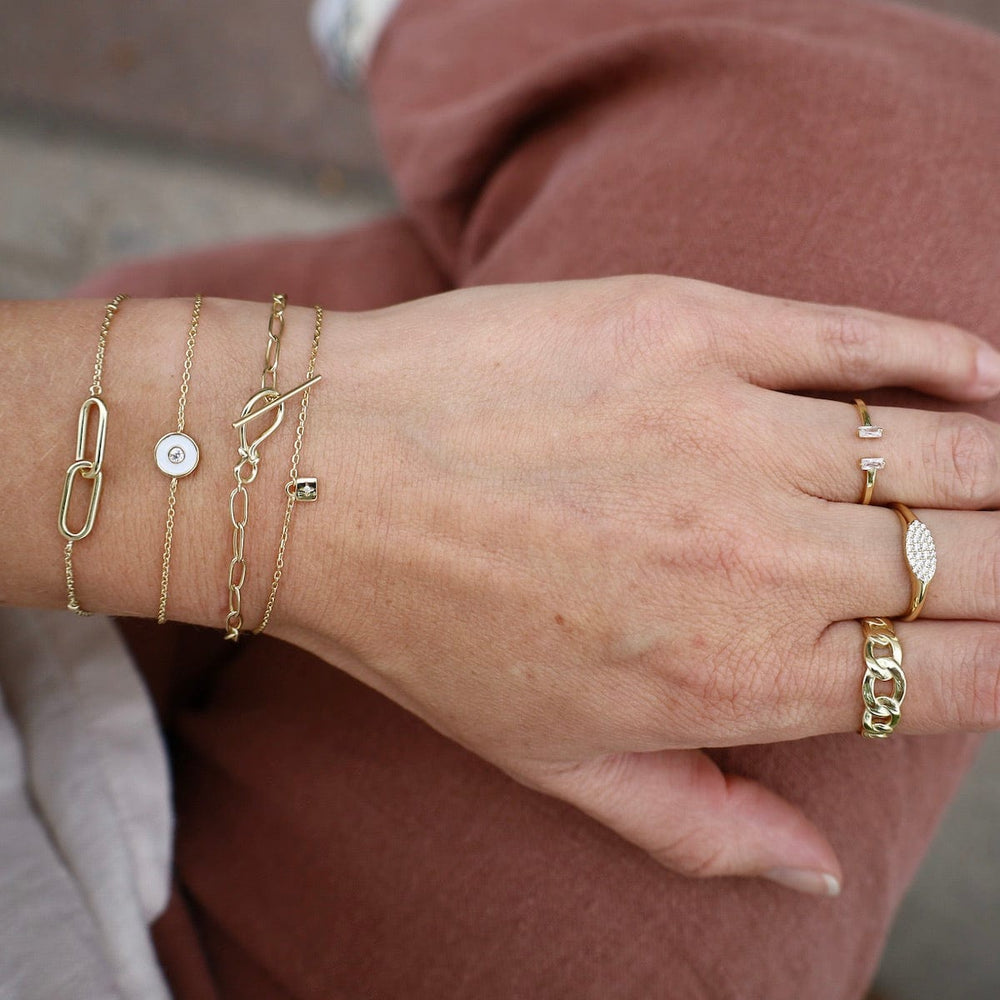 
                      
                        BRC-GPL Optic White Enamel Disc Gold Bracelet
                      
                    