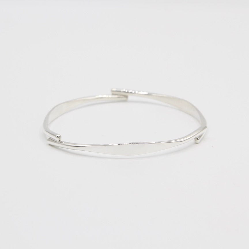 
                      
                        BRC Hammered Bangle with 3 Overlap Points
                      
                    