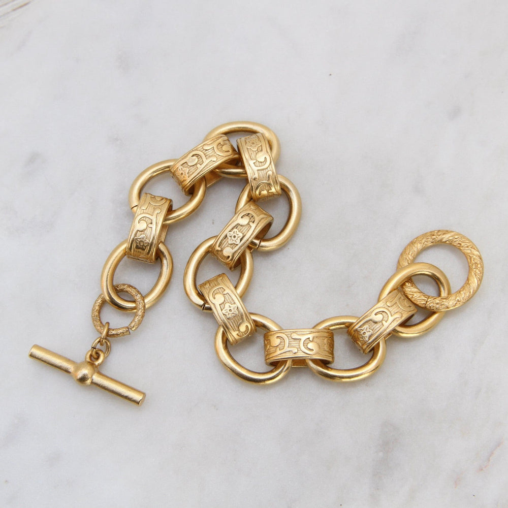 
                  
                    BRC-JM Alternating Pattern & Plain Link Bracelet - Gold Plate
                  
                