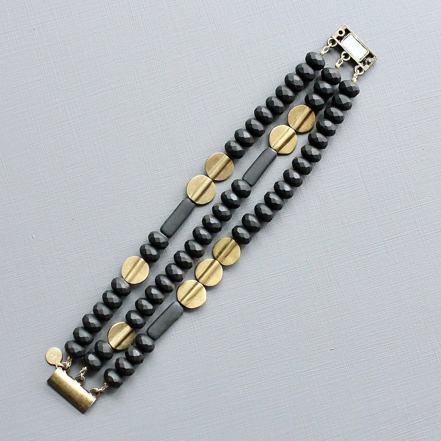 BRC-JM Black and Brass Triple Strand Bracelet