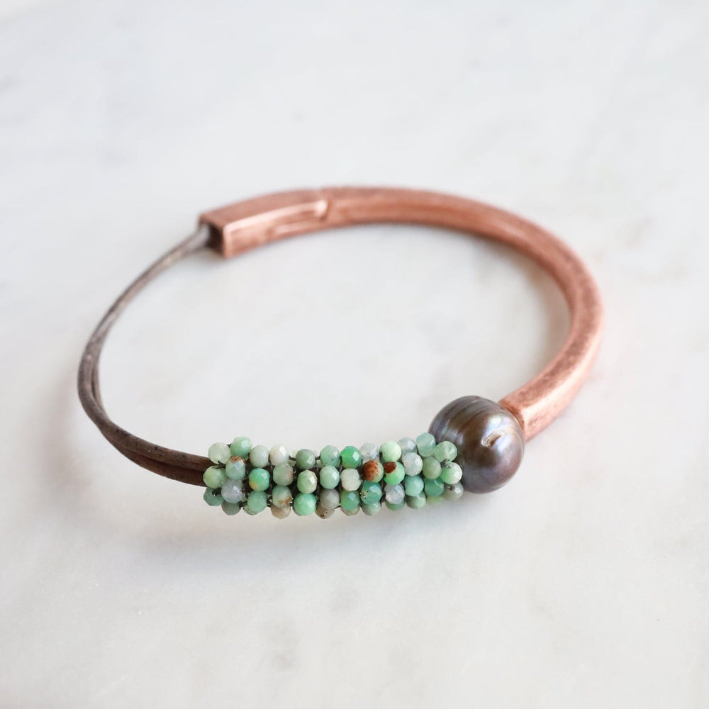 
                  
                    BRC-JM Chrysocolla with One Large Chocolate Pearl Hand Stitched Leather Copper 1/2 Cuff
                  
                