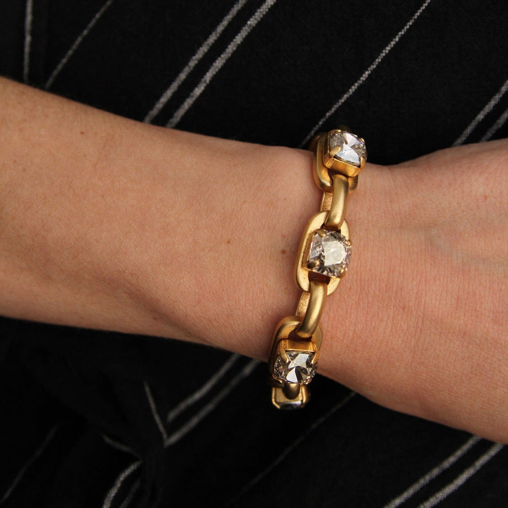 
                      
                        BRC-JM Chunky Oval Link Bracelet with Four Crystals - Gold Plate
                      
                    